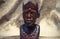 Close up of African traditional wooden Statue figurine on a fur background