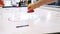 Close-up of air hockey table and person`s hand playing with robot. Media. Different working robots collection presented