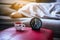 Close up of alarm clock with woman sleeping on bed blur background