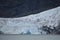Close up Alaskan Glacier running to the ocean