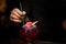 Close-up of alcohol drink decorated with flower, lemon zest and straw