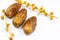 Close-up of Algerian royal dates on a white background.