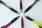 close-up of aligned pens on a white background