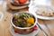 Close up of aloo palak dish in bowl on table
