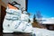 Close-up of alpine ski boots on balcony rail -vacation concept