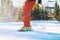 Close up of an alpine skiers legs on the slope at a winter ski resort