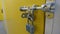 A close up of an aluminium padlock and door bolt on a self  storage unit door