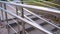 Close-up of aluminum ramp in motion. The camera follows the route going on the sidewalk. Great walk around the city.