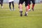 Close up of american football players stretching and warming up