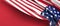 Close up of american USA flag, 4th of July Independence Day. Left Side Copy Space on Red Background