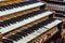 Close up of ancient pipe organ keyboards in european cathedral