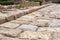 Close up of ancient roman road ruins in Tarraco forum Tarragona