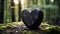 Close up of a anthracite wooden Heart in a calm Forest. Blurred natural Background