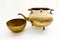 Close up antique brass tea set on white background. The antique collection