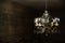 Close-up of antique chandelier with big yellow lightbulbs.Round big vintage lamp on black background.luxury big