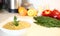 Close-up appetizing lentil porridge in a white dish on a light kitchen countertop. Top down. Healthy eating concept.