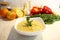 Close-up appetizing lentil porridge in a white dish on a light kitchen countertop. Top down. Healthy eating concept.