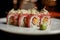 Close up of appetizing sushi roll set decorated with sprouts served on white plate with wasabi on black background