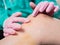 Close-up Applying a healing ointment to a bruise on the leg. Family doctor examines leg injury