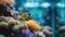 Close-up of an aquarium, with colorful clownfish among colorful coral reefs, and against a blurred office background.