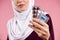 Close up. Arab woman in hijab holding pills