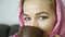 Close-up of arabian woman in pink hijab drinks coffee