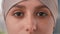 Close up of arabian womans face. Girl opening her beautiful light brown eyes. Attractive face of arabian woman in hijab