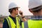 Close-up Architect and Civil Engineer checking work with walkie-talkie for communication to management team in the construction