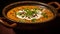 Close up of aromatic dal makhani with creamy topping