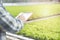 Close Up asian man hands holding paper documents with pen and writing a notes report of quality green organic vegetable in