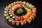 Close-up of assorted sushi pieces arranged in a circular pattern, showcasing the artful presentation