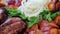 Close-up of an assortment of grilled meats, smooth camera movement