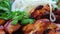 Close-up of an assortment of grilled meats, smooth camera movement