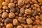 Close up of assortment nuts on a wooden table: wallnuts, almonds