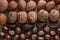 Close up of assortment nuts on a wooden table: wallnuts, almonds