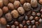 Close up of assortment nuts on a wooden table: wallnuts, almonds