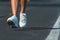 Close up of an athlete`s feet wearing sports shoes on a challenging track. Trail running workout on on stadium