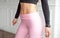 Close-up athletic female body slim elegant waist of a stylish fitness model with perfect figure lines after an effective