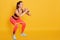 Close up of athletic woman in squat in gym, fit girl exercising with resistance band for lower body relief, sporty lady wearing
