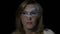 Close up of an attractive IT blonde woman wearing google glasses while having running programming code on her face -