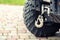 Close-up atv quadbike whick hook mounted on offroad all-terrain vehicle