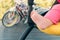 Close-up of baby barefoot in stroller outdoor