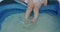 Close up of baby girl legs in water