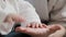 Close-up baby little infant newborn cute hands touching clapping hit beat male hand father arm. Details dad kid child