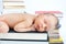 Close-up of baby sleep on the books