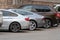 close-up of back side of parked cars in outdoor parking area