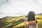 Close up back view of brunette woman taking smartphone photo