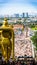 Close up back view portrait of Lord Murugan Statue in foothills of limestone outcrop, Batu Caves Gombak