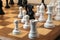 Close -up of back and white chess pieces, wooden board