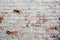 Close up background of brick wall, different shape adobe, horizontal rough abstract shabby old worn surface texture